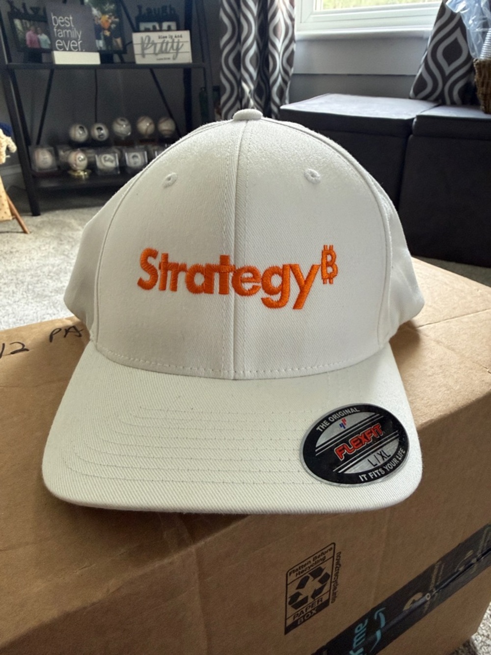 Strategy White Flexfit Baseball Cap with Orange Embroidery